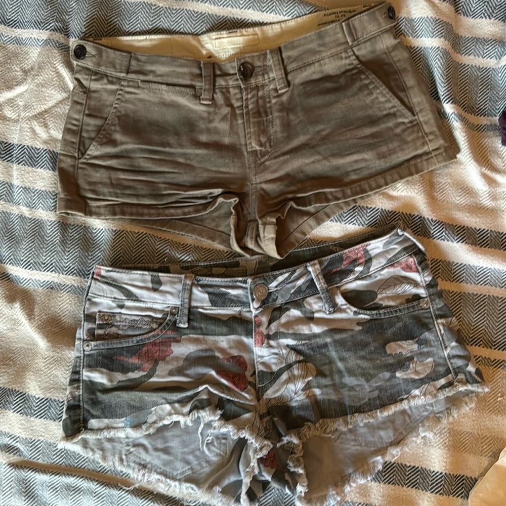 2 pairsof shorts . All Saints size 8 and true religion camo size 27
